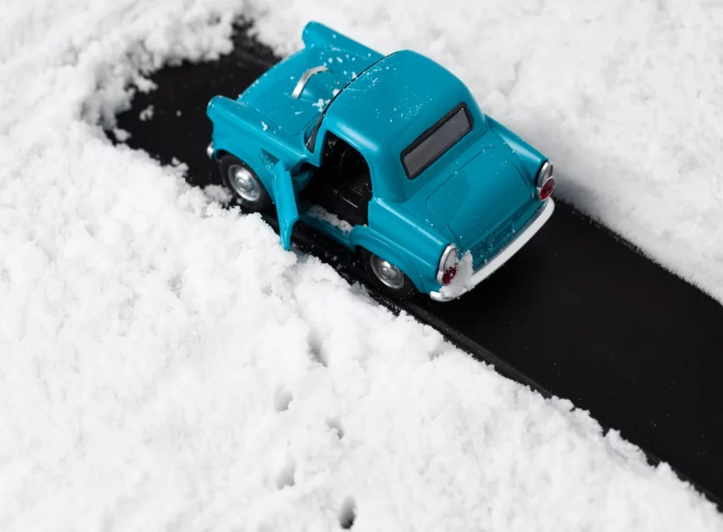 close-up view of blue toy car with snow